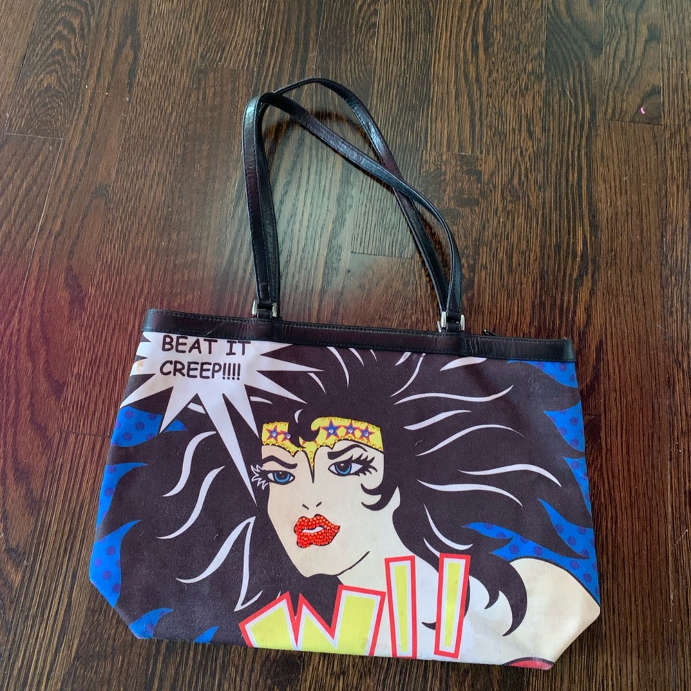 Pre-loved whimsical and functional Isabella Fiore Wonder Woman pocketbook.